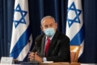 Israeli PM says exit from COVID-19 lockdown to last 6-12 months 