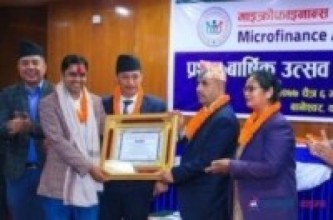 लघुवित्त सङ्घको अध्यक्षमा पुनःपोखरेल, पत्रकार भण्डारीसहित सात सम्मानित